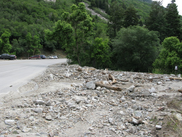 Debris still fills a trail-head lot.