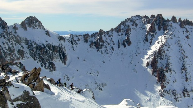 SGT campers and guides transitioning on the ridge about to ski/ride a sweet zone.