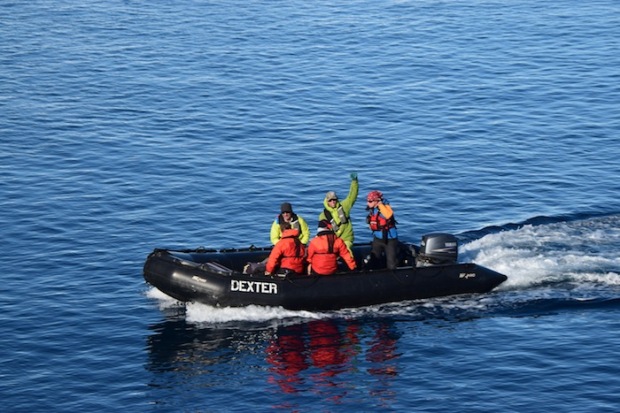 Miles and clients claiming it in Antarctica. These Zodiacs are how we got around.