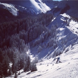 Local snowboarder Dwight Burks airing off the Cornice into Juarez