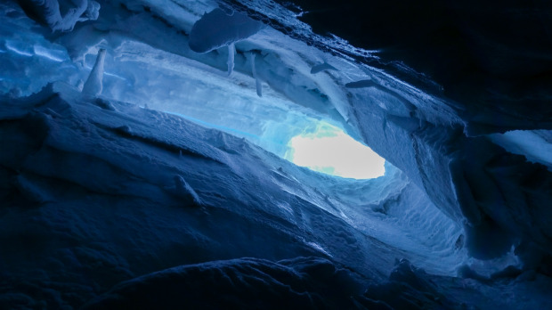 Looking up from my resting place on the snowbridge at the hole I fell into and the ice I slid down