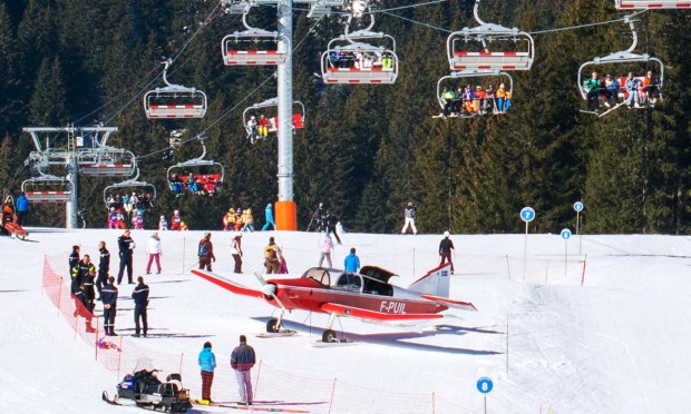 Emergency services gather around a plane which had earlier hit a woman skier while attempting take off at the French Alpine ski resort of Avoriaz. Photograph: Stephane Lerendu/AFP/Getty Images