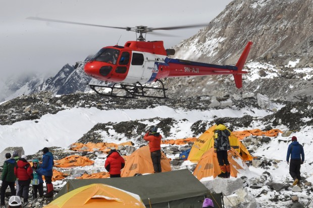 Injured climbers and Sherpa being airlifted from basecamp yesterday.  photo:  afp