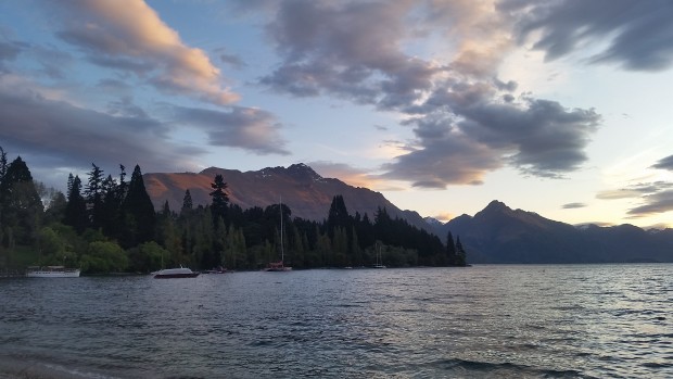 the final rays of the sun as seen from a Queenstown beach