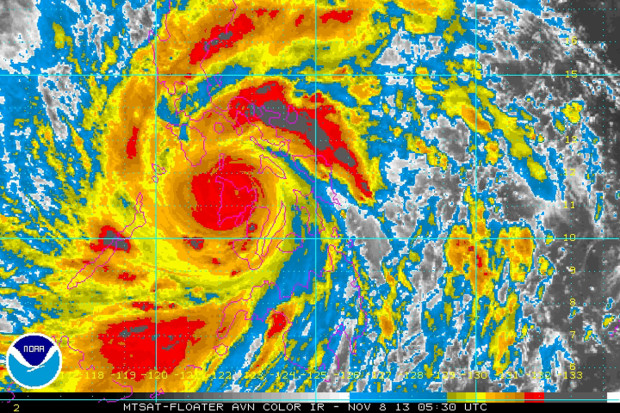 image by NOAA, Friday Nov. 8, 2013. taken at 12:30 a.m. EST shows Typhoon Haiyan as it hits  the Philippines.