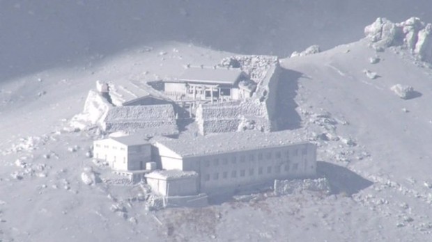 Mountain lodge buried in ash after eruption on Mt. Ontake. photo: kimmasa mayama/epa