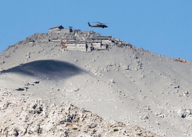 Mountain lodge buried in ash after eruption on Mt. Ontake. photo: kimmasa mayama/epa