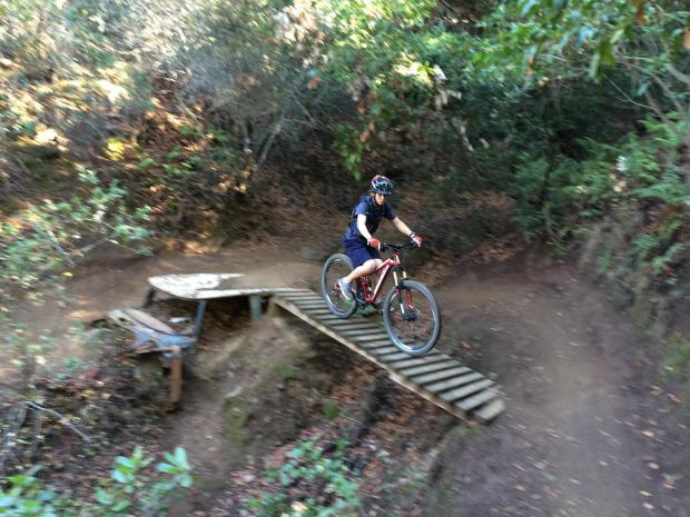 Here you can ride over an old car onto a sketchy bridge out into a banking turn.