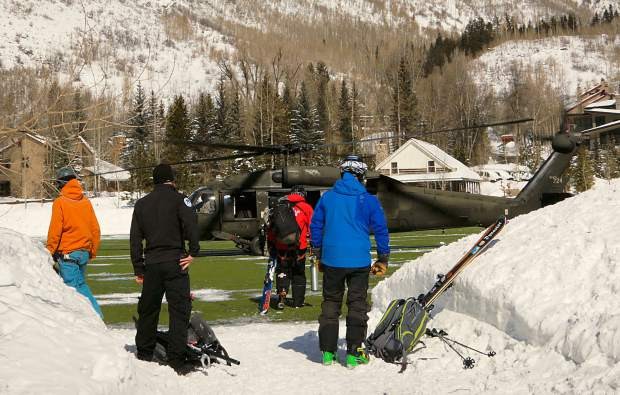 Blackhawk helicopter transporting the injured skier.