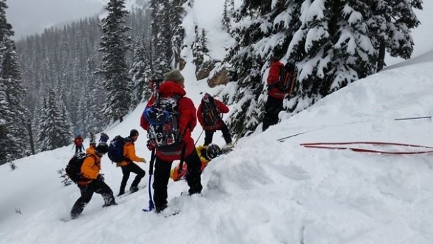 Grand Country SAR extracting the injured skier from the avalanche zone yesterday.