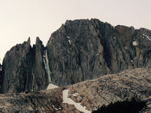 The North couloirs on North Peak on July 2nd. This one is a real tragedy. The right couloir was the holdout that we could always rely on for summer alpine ice and it is one of the few easily accessible in a day from the car. This photo shows that the upper couloir, which melted out for the first time in ice climbing history, near the end of last season has already begun to melt out again. This exposes loose rock that comes raining down the couloir.