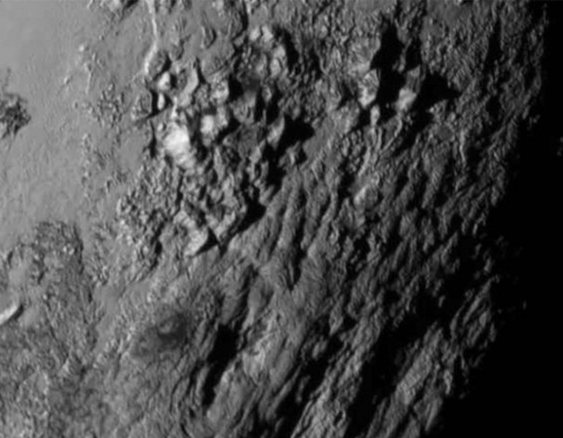 The Ice Mountains of Pluto via New Horizons spacecraft