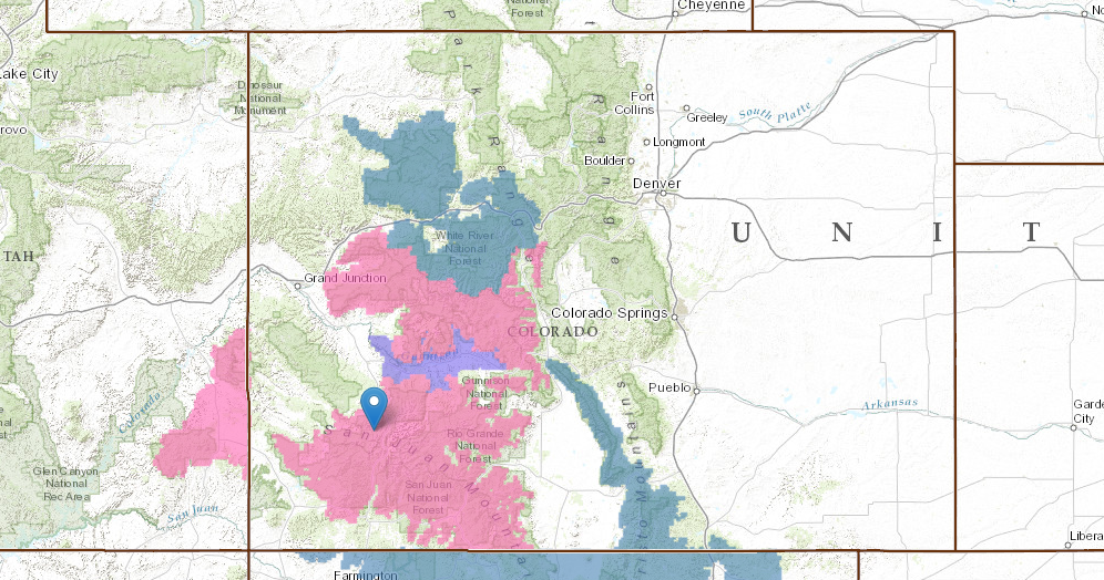 Pin = Telluride. PINK = Winter Storm Warning. BLUE = Winter Storm Watch. BLUE = Winter Weather Watch.