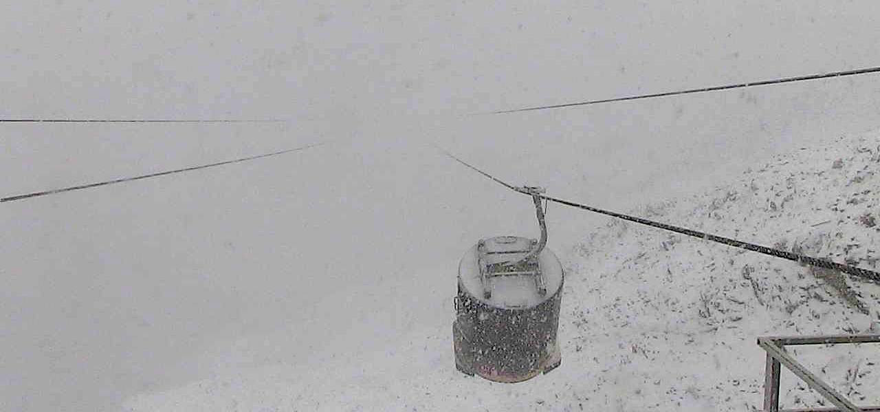 Lone Peak Tram at Big Sky, MT in a big snowstorm on Sept. 15th, 2015.