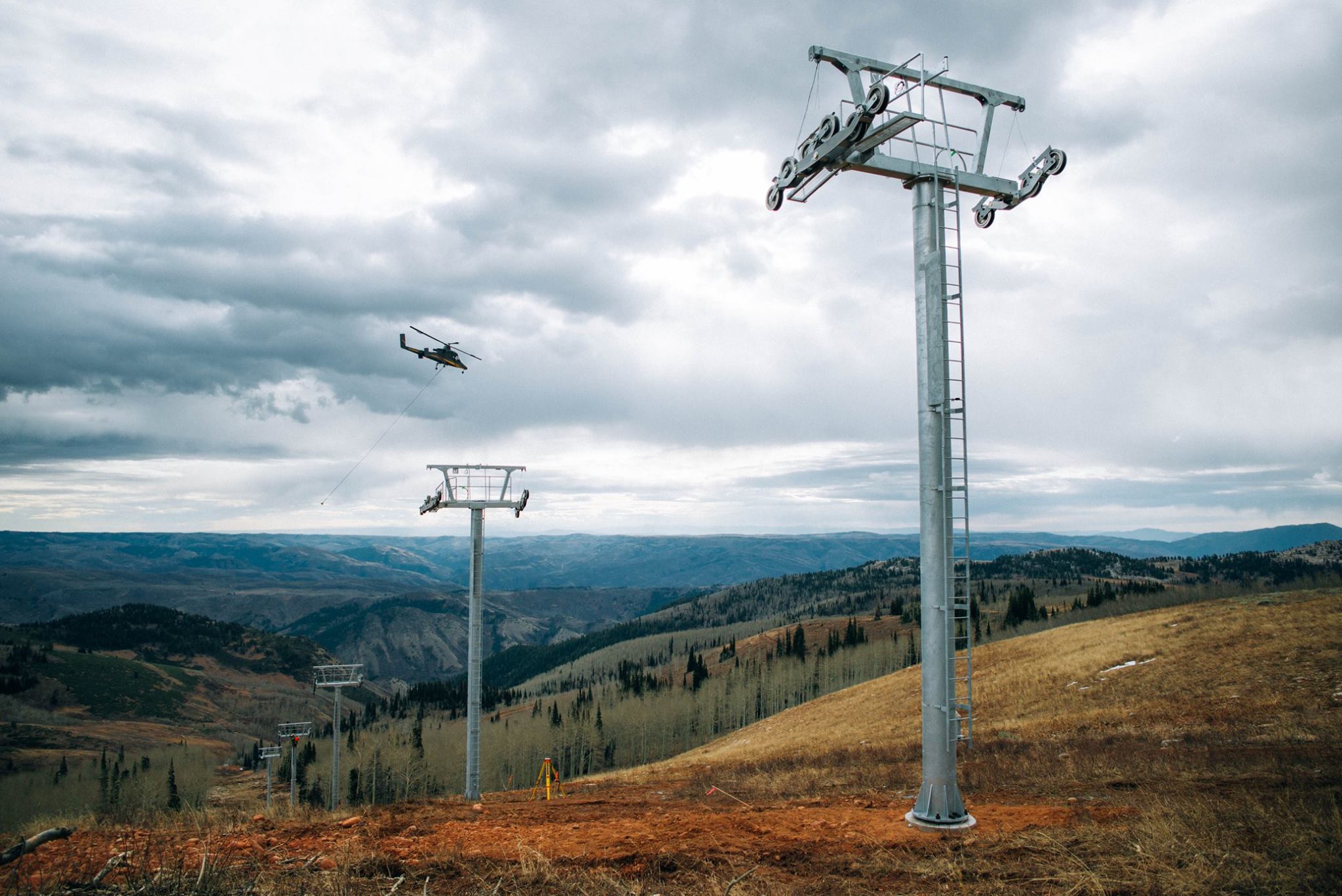 A helicopter installing lift towers for one of the two new lifts being installed at Powder Mountain.  photo:  Powder Mountain