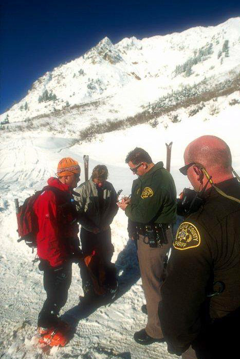 “Okay, two cheese Danish, a cinnamon twist, two maple bars and a 64oz Dirty Dr. Pepper.  Anything else for you today?”  Trading digits with the SLC Sheriffs.  Photo: Carl Skoog