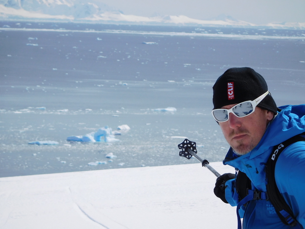 Rich Meyer pointing out something very cool. An archway in an iceberg. image: miles clark