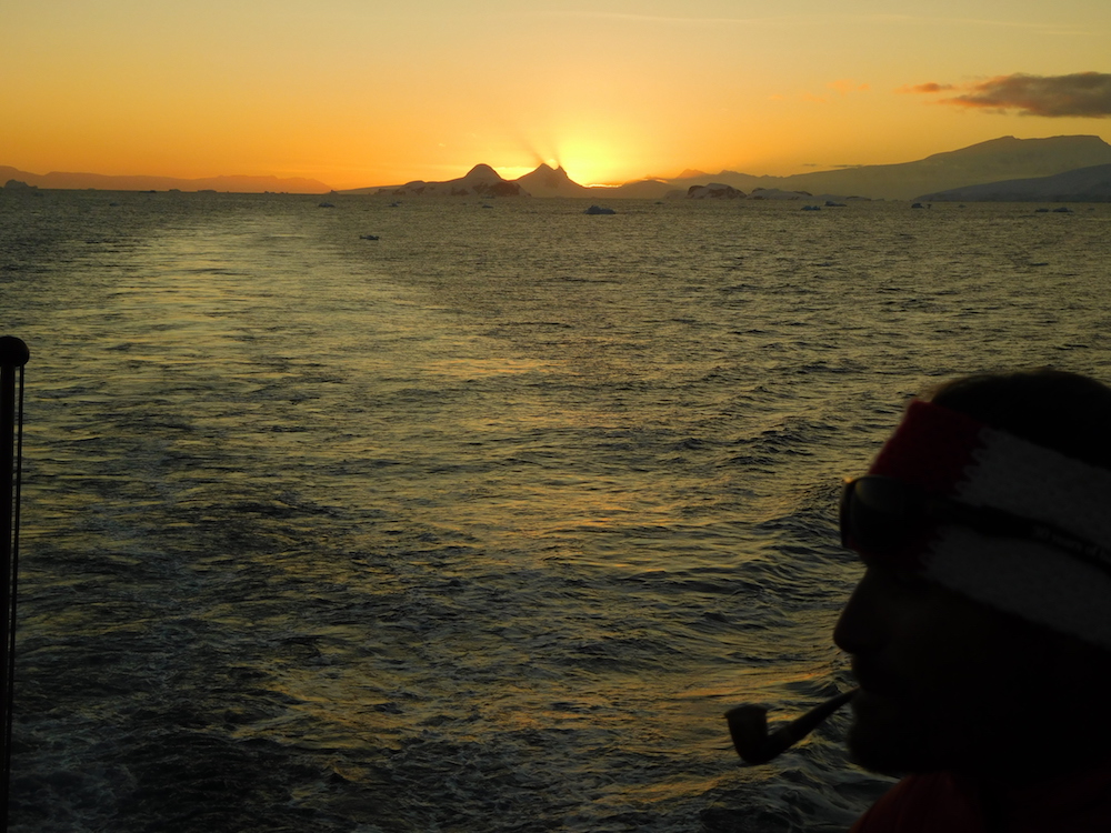 Mountain guide Joe, pipe, and sunset. image: miles clark