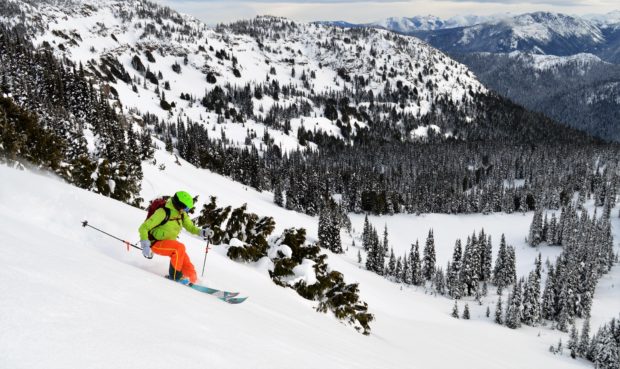 Cori drops into Cement Basin off East Peak
