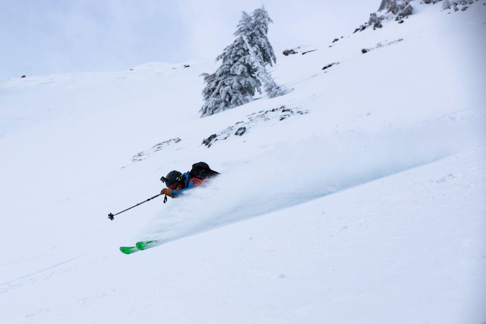 skier rushing down slope