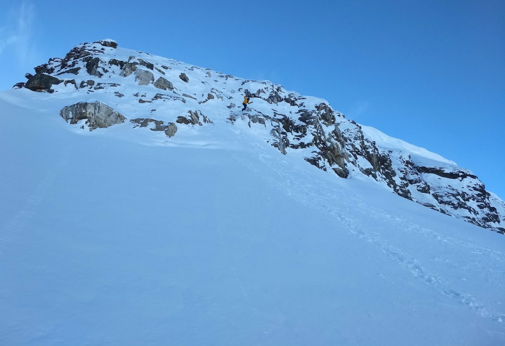 snowboarder jumping off cliff