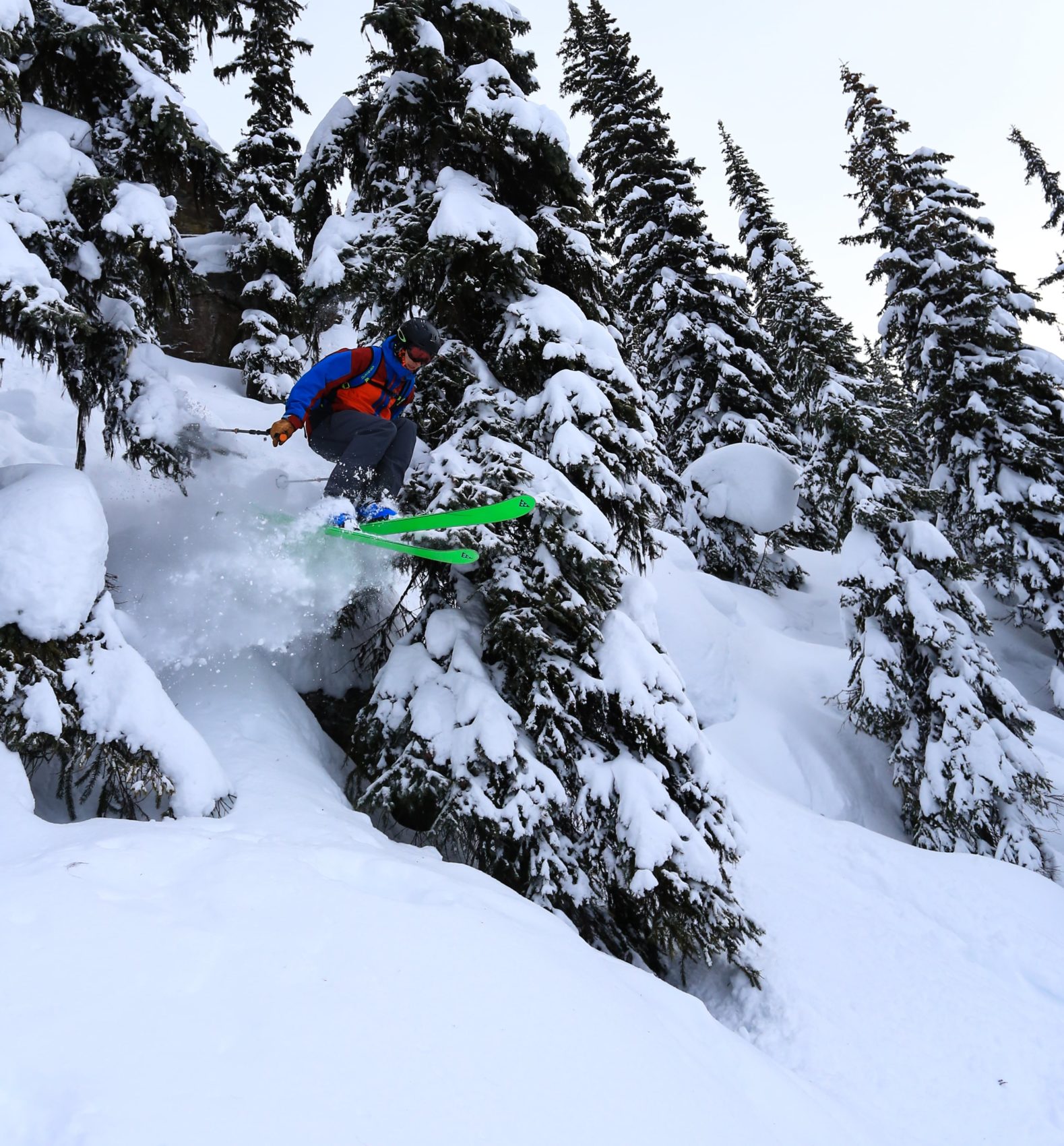 skier jumping off pillow in revelstoke