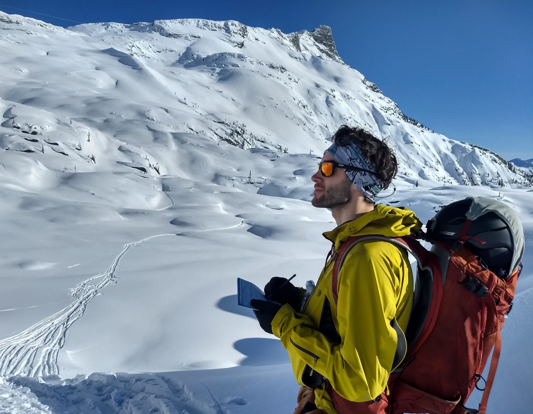 backcountry skier checking out avalanche danger