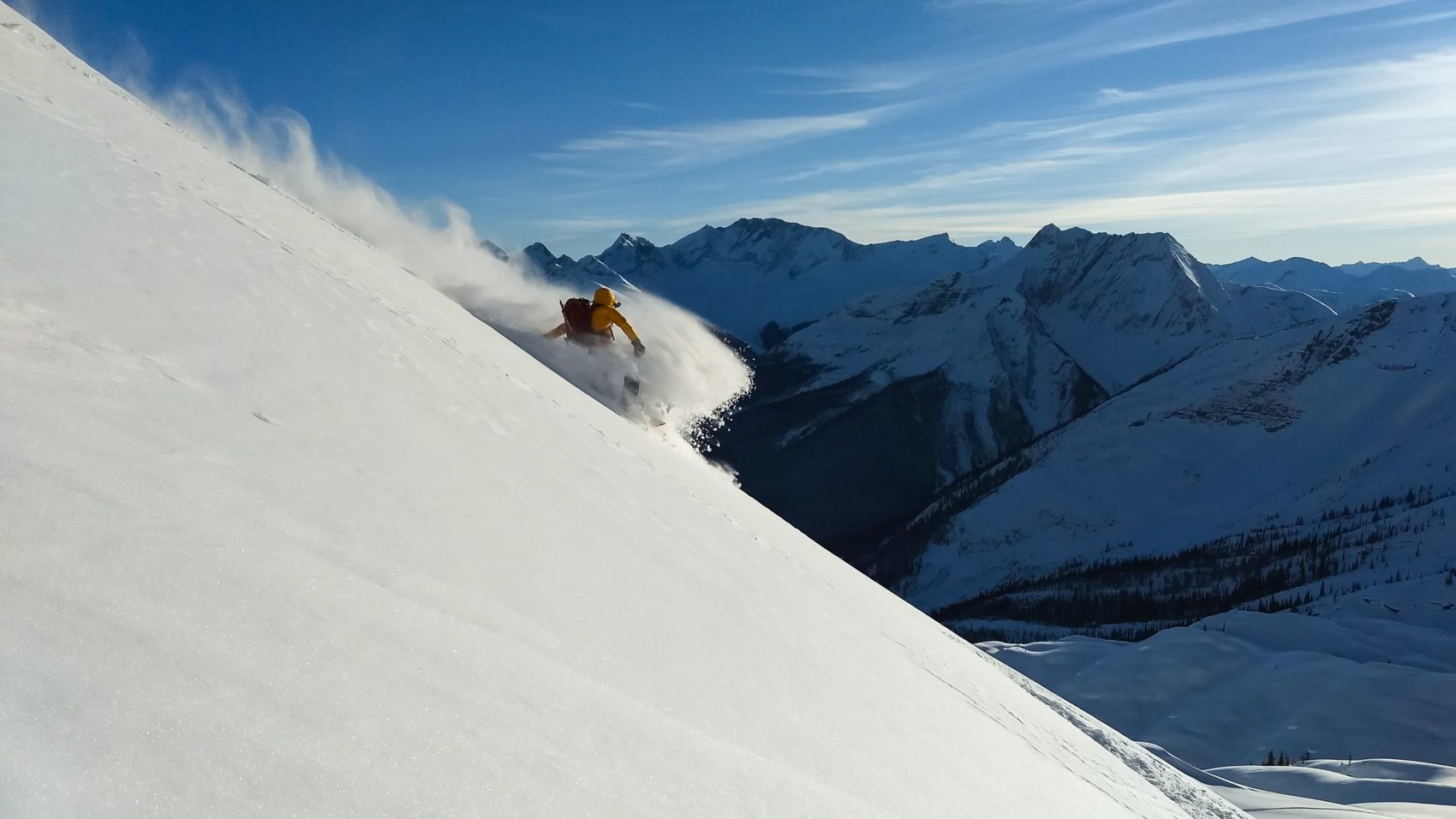 snowboarder carving down the hermit valley