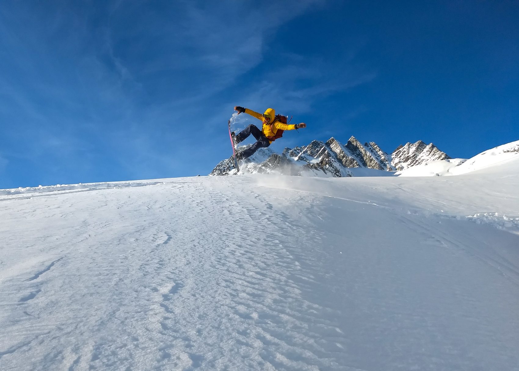 snowboarder tricks on rogers glacier