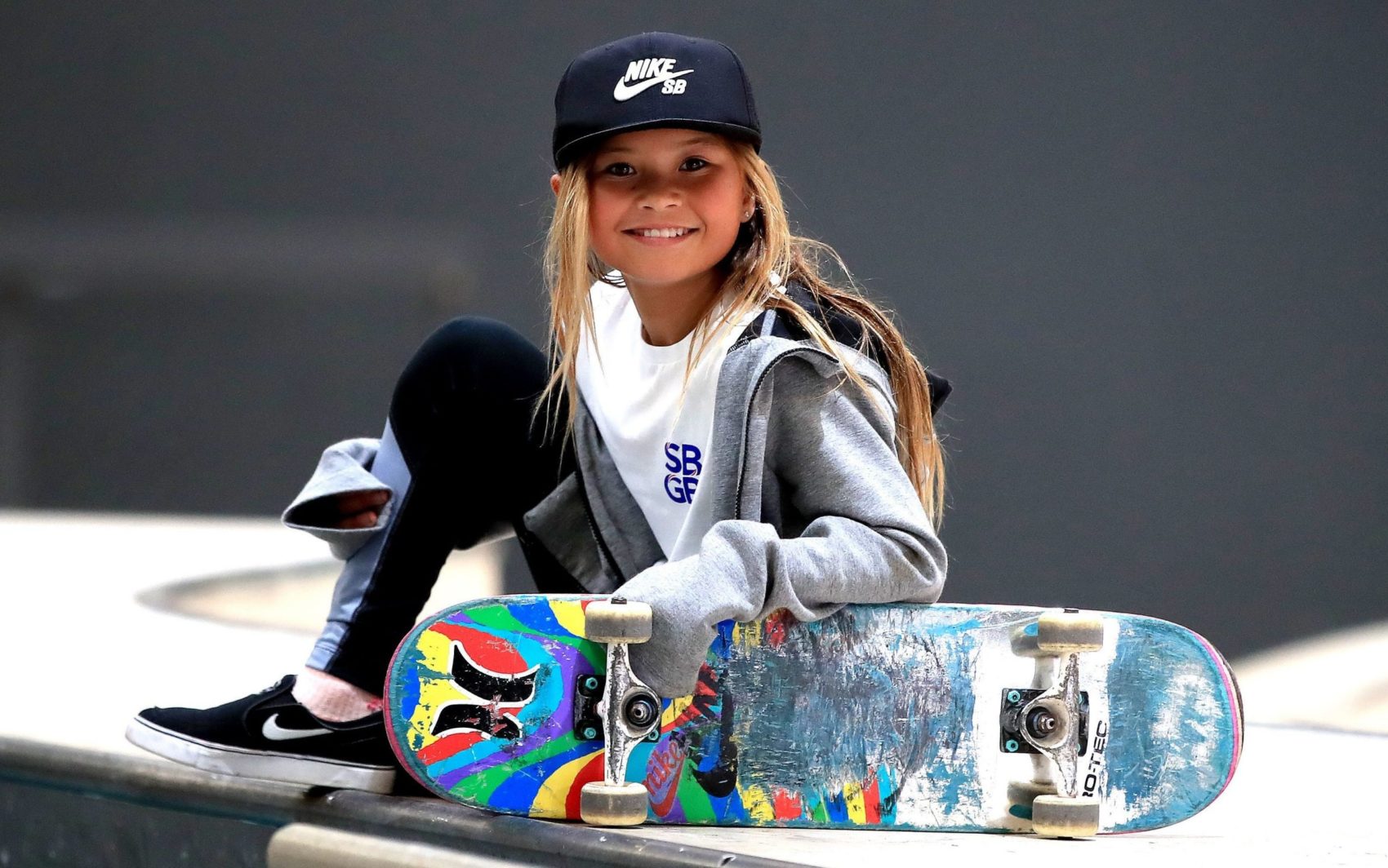 Sky Brown poses with one of her many skateboards.