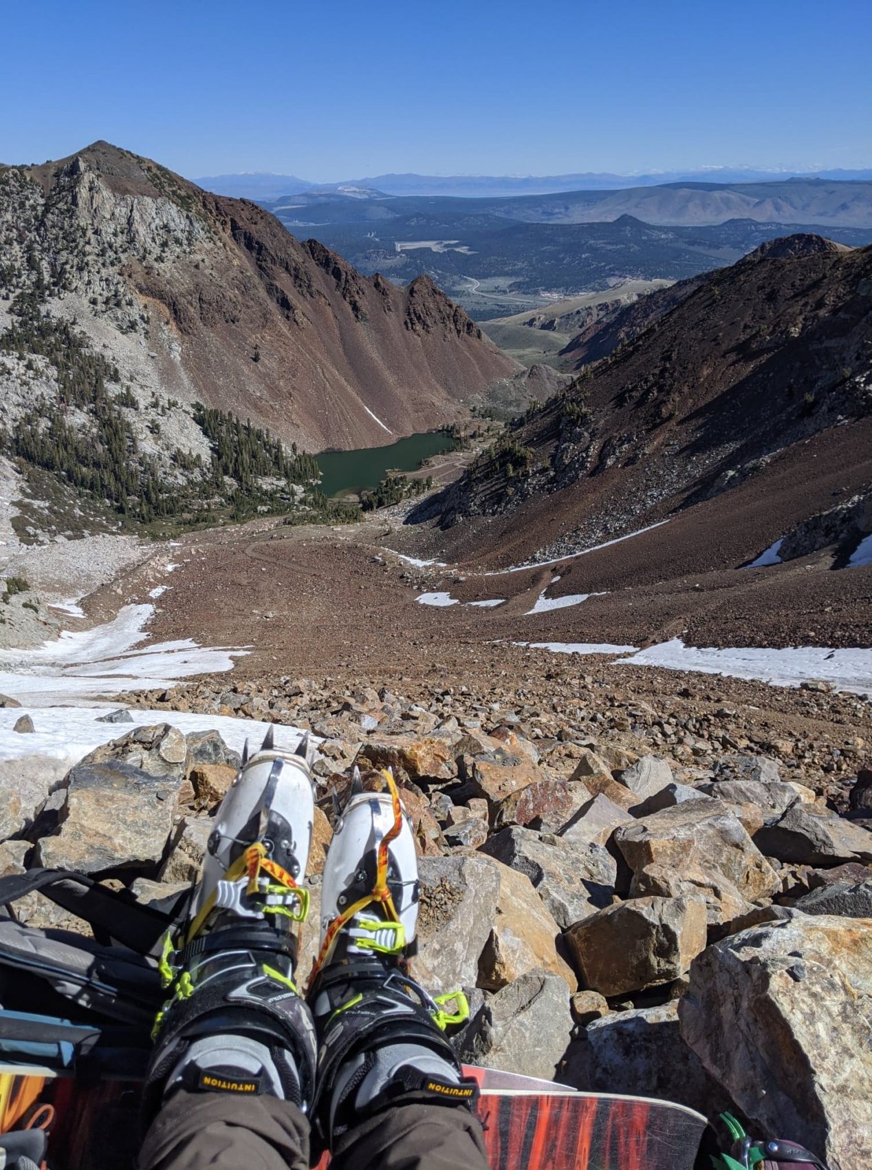 Crampons, ski boots, boulder, dirt, rocks, snow