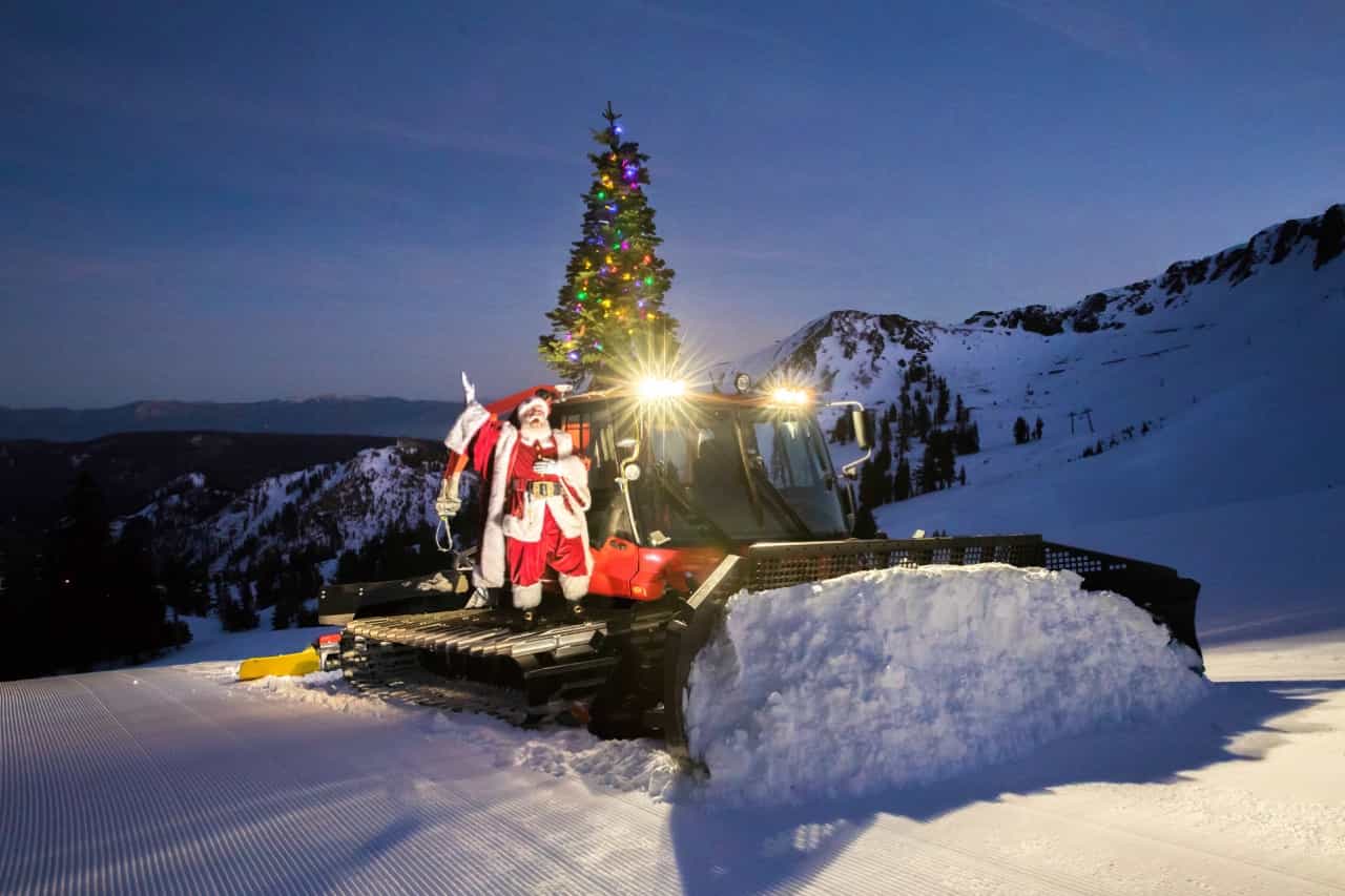 santa on a snow groomer at Palisades Tahoe 