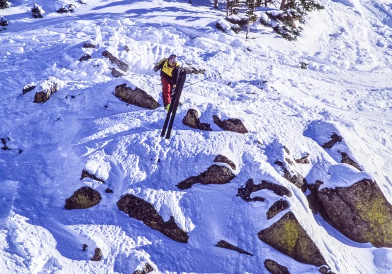 Shane McConkey sending a cliff in the US Extreme Skiing Championships at Crested Butte in 1997. Photo Credit: Flip McCririck