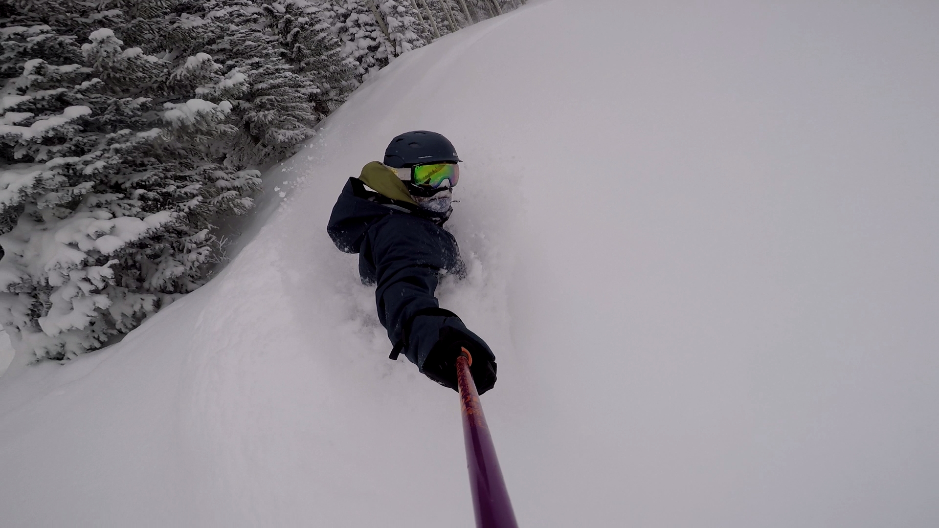 snowboarder in very deep snow at powderhorn mountain resort colorado