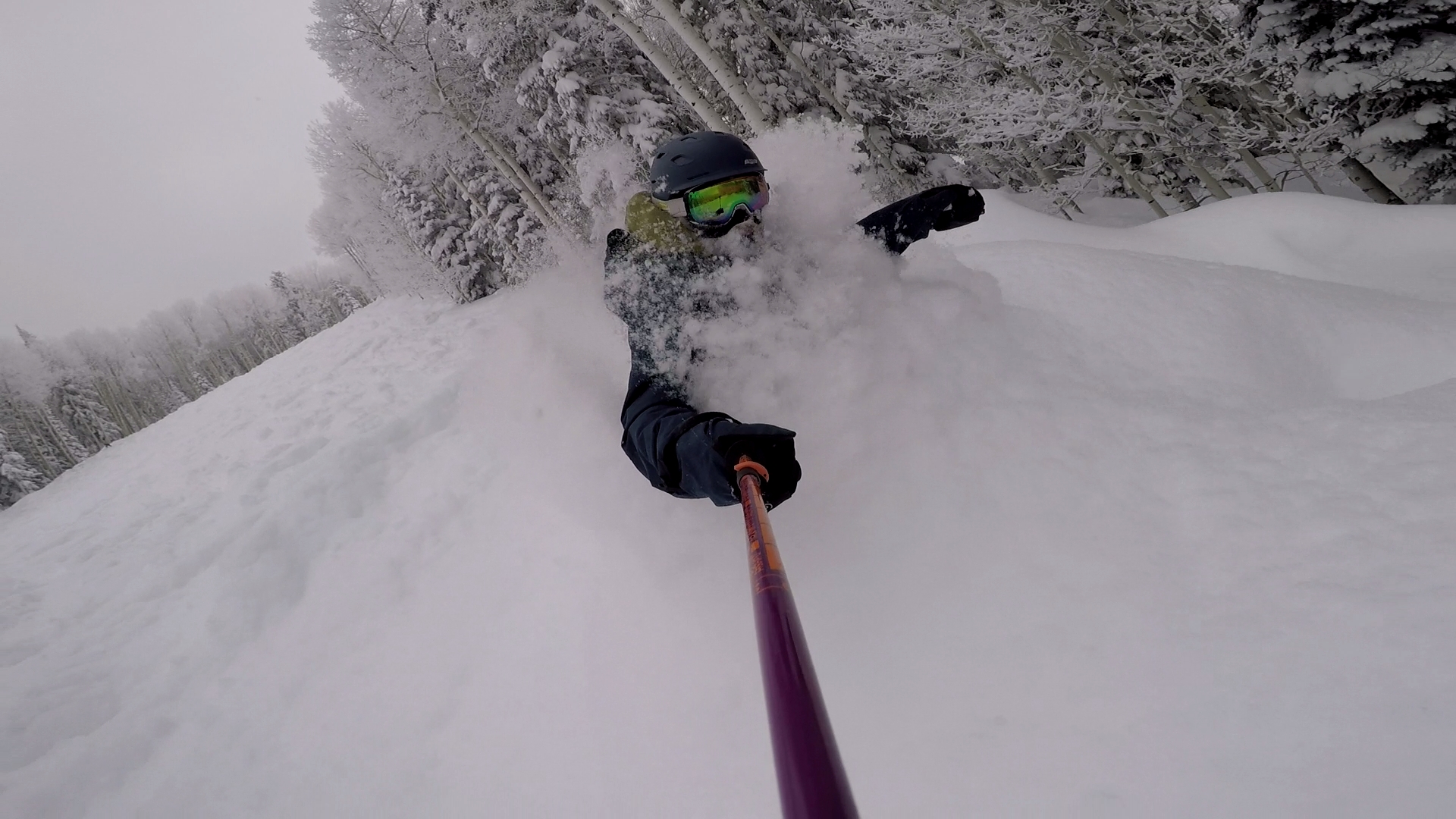 snowboarder in very deep snow at powderhorn mountain resort colorado