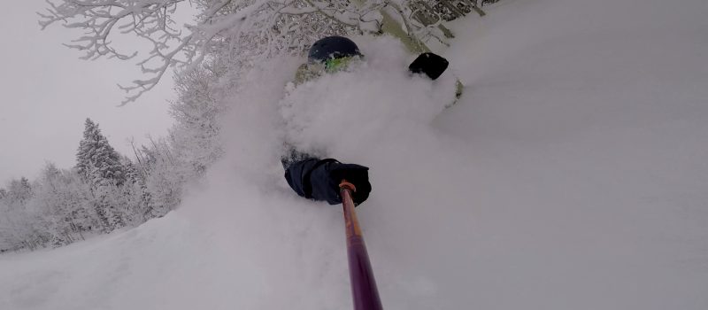 snowboarder in very deep snow at powderhorn mountain resort colorado