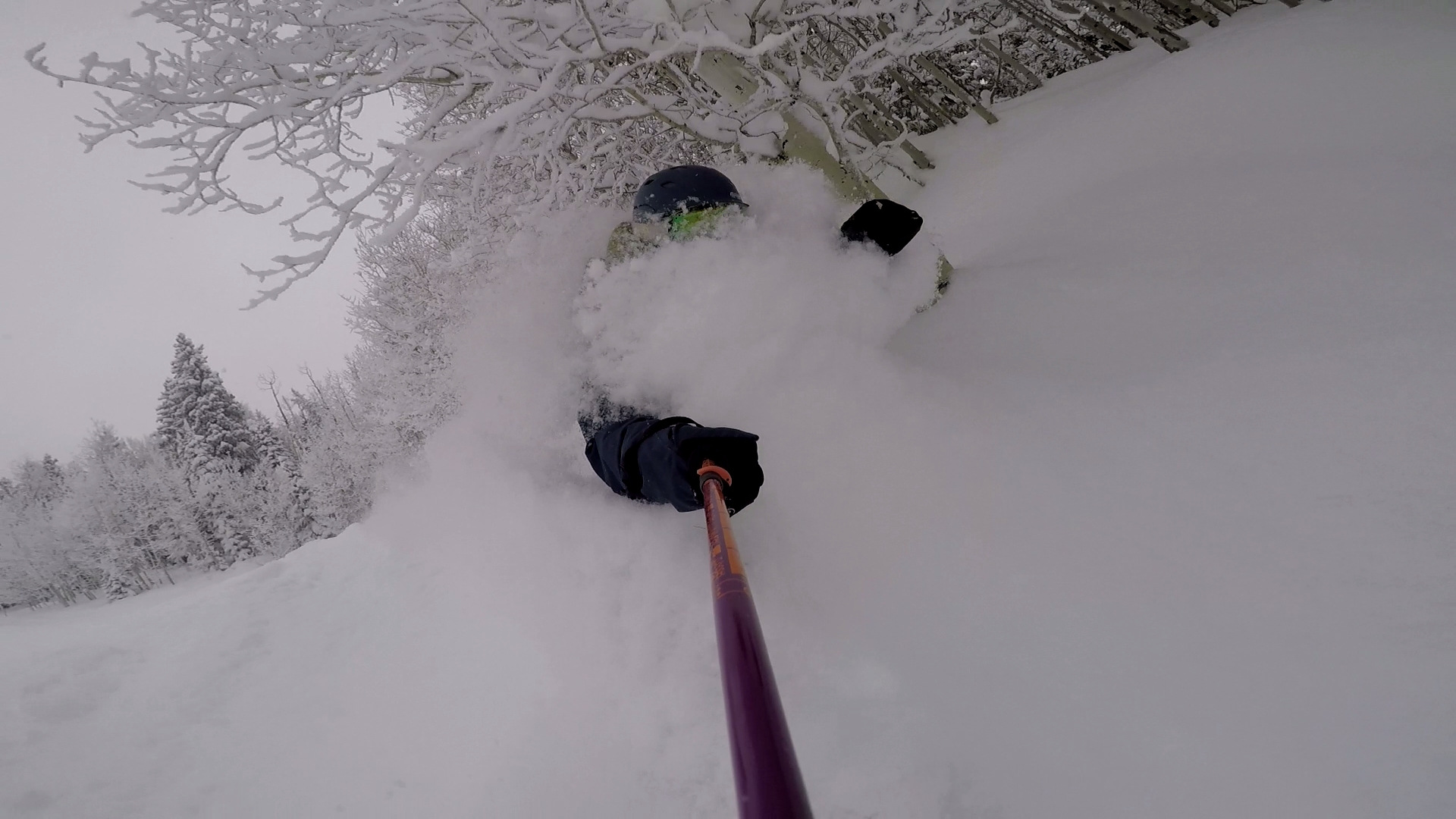 snowboarder in very deep snow at powderhorn mountain resort colorado