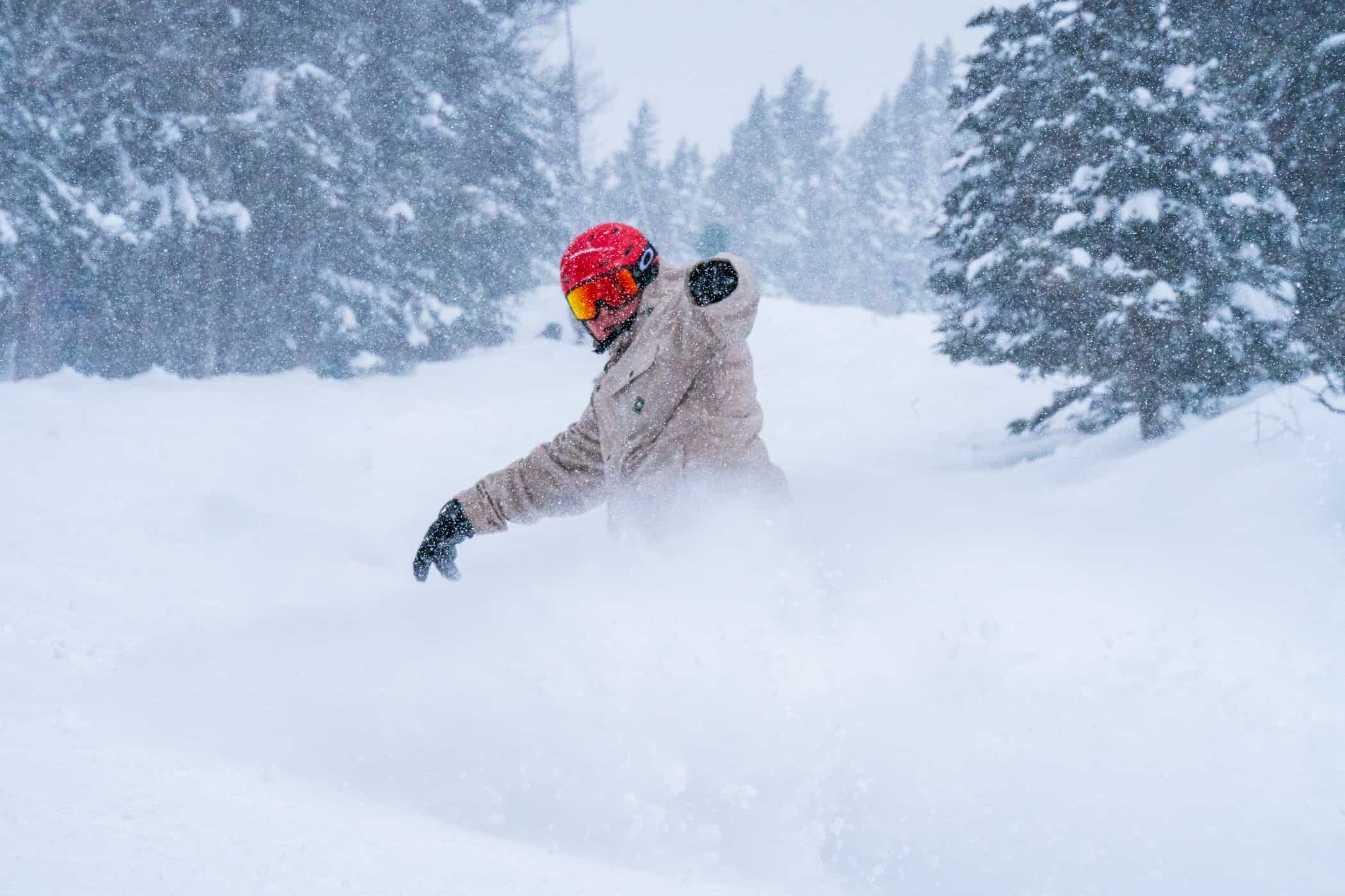 snowboarding slashing deep powder