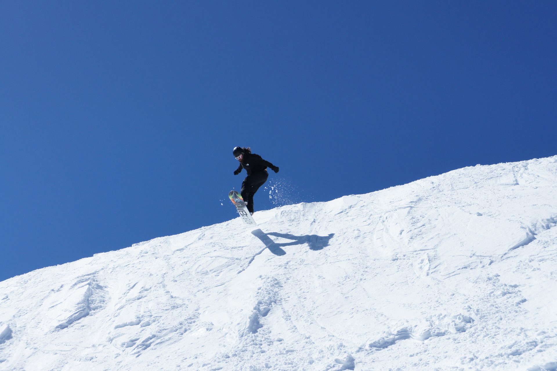 snowboarder launching a lip