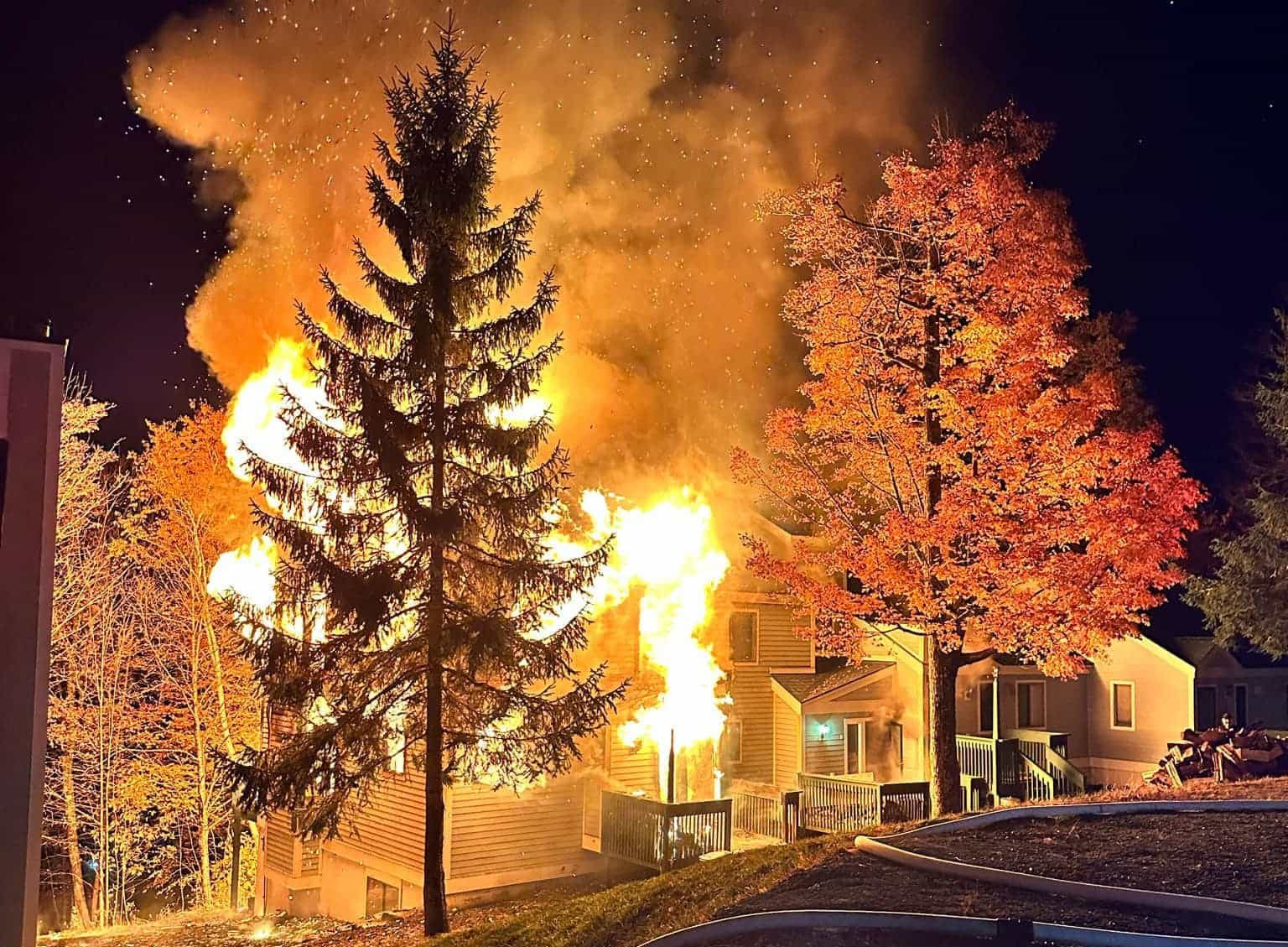 condo building on fire during the night at ski resort
