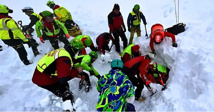 rescuers searching for survivors following an avalanche in the lepontine alps, Italy