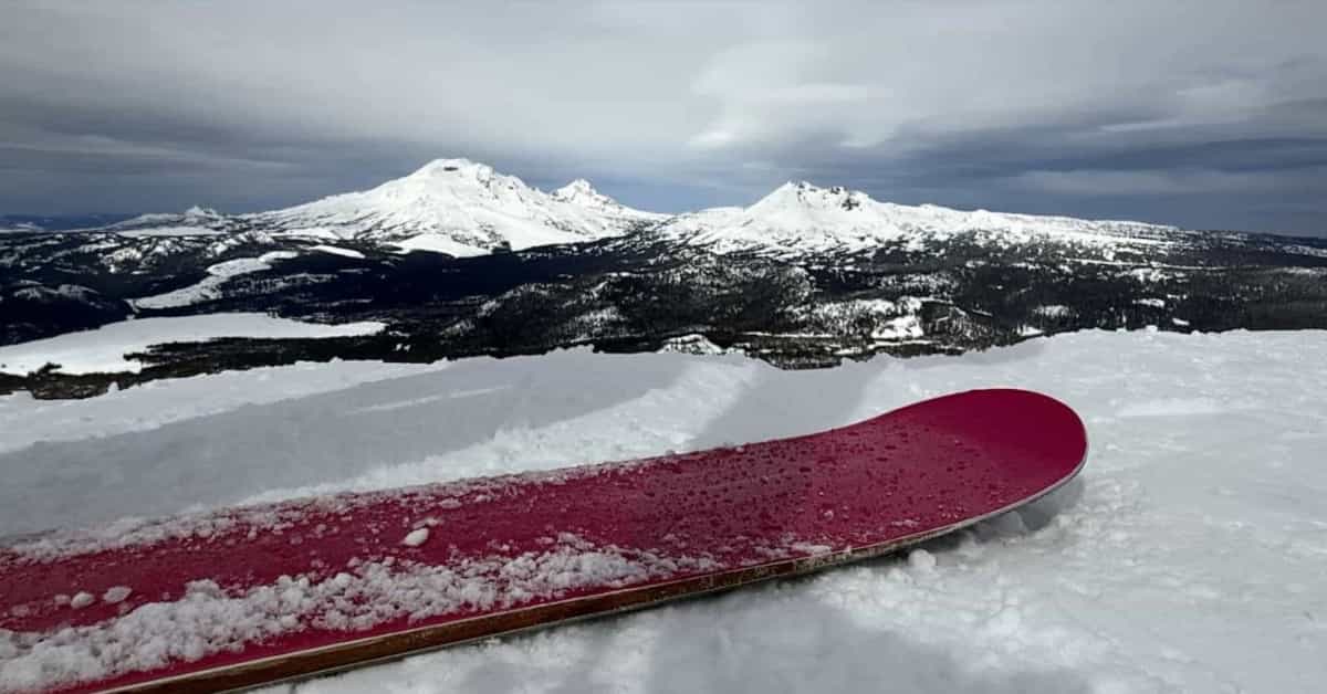 A Coda Phoenix monoski at the top of Northwest in the foreground; the Three Sisters and Broken Top in the background. | Photo: Nicky Blumm