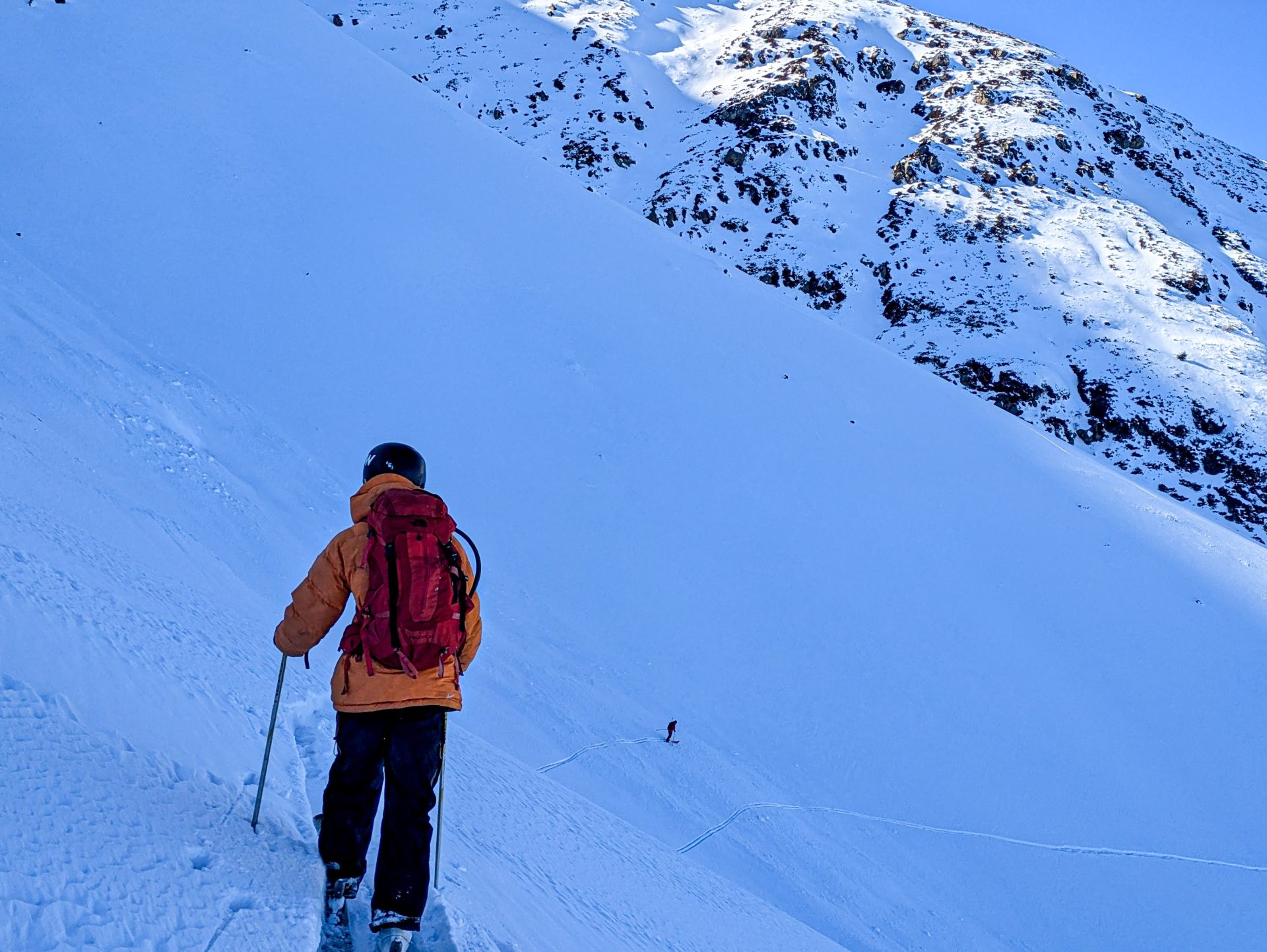 I am following my guides in a traverse across the mountain