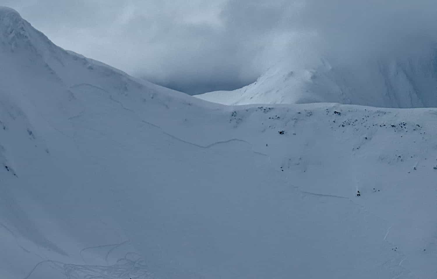 Large slab avalanche triggered by a snowmachiner that resulted in the rider being fully buried and killed.